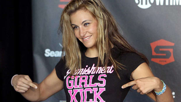 HOFFMAN ESTATES, IL - JULY 29:  Miesha Tate stands on stage at the Strikeforce: Fedor vs. Henderson weigh-in at Sears Centre Arena on July 29, 2011 in Hoffman Estates, Illinois.  (Photo by Josh Hedges/Forza LLC/Forza LLC via Getty Images)