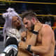 The night opened with one of two single's matches to fill the two open spots in the North American Championshp ladder match and Johnny Gargano, accompanied by his wife Candice LeRae, took on big, beefy, muscular, swole guy Ridge Holland in a David vs. Goliath type of match. Johnny tried to pick apart his bigger opponent, who swatted him away at several points, but Johnny was able to attack Ridge's leg and ribs to slow the big guy down to a point. However, a botched slam stopped the match momentarily, hopefully Johnny is real life okay because he fell directly on his head and it looked brutal. But Gargano being the fighter and opportunist that he is, shook it off as best as he could to continue the match, despite clearly being bothered. Candice would soon her husband out, getting a shot on Holland's family jewels, opening Johnny to connect with the One Final Beat DDT to win the match and his spot on the ladder match.A couple of things here, Johnny winning was the right call. What is TakeOver without Johnny Gargano? Win or lose he is usually one of the top performers on any given TakeOver stage. But after the build up for Ridge Holland and his debut, he's in danger of needing character rehab already, he's zero for two in two matches already, despite being protected slightly this time around. That botch nearly took my interest out of the match, kudos to Johnny for finishing after that nasty spill, he seemed to be okay by the end of the night, which brings us to...