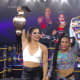Raquel was in the ring and everyone was so excited about our new NXT women's champion when Rhea's music hit and the new Raw Women's champion came to join her in the ring and not long after the Smackdown women's champion also joined them. This is the big moment I was waiting for. I got goosebumps watching it. NXT really did create some amazing talent that will hopefully save the future of women's wrestling. I can't imagine how the girls felt being together again in front of their old photo but this time holding all of the gold. Currently every women's champion including tag teams came from NXT and it's amazing. 