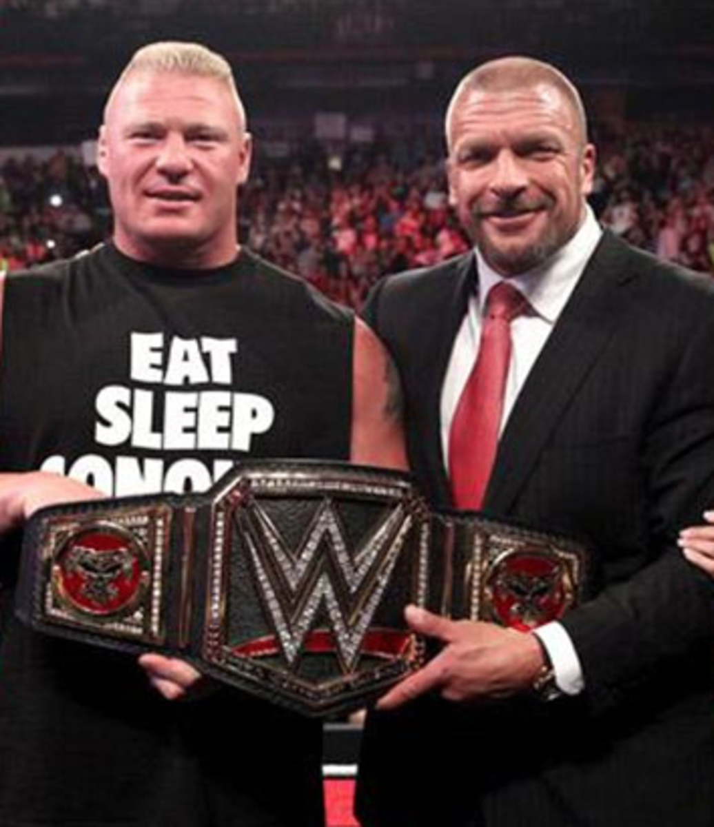 Brock Lesnar & Triple H with new WWE title belt